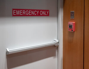 Latch and door handle of emergency exit. Push bar and rail