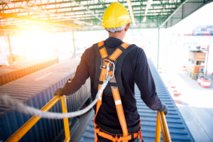 Construction worker use safety harness and safety line working o